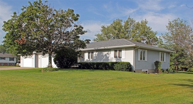 311 W View Dr, Osceola, IA 50213 - view of front of house featuring a front lawn, concrete driveway, a shingled roof, and a garage