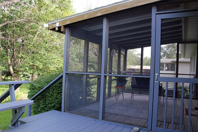311 W View Dr, Osceola, IA 50213 - wooden deck with a sunroom