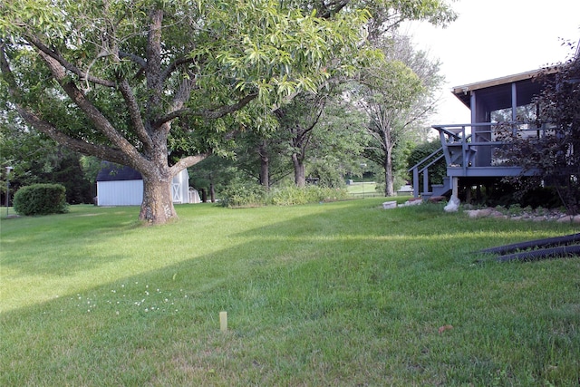 311 W View Dr, Osceola, IA 50213 - view of green lawn featuring stairway and a wooden deck