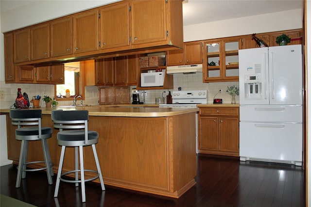 311 W View Dr, Osceola, IA 50213 - kitchen featuring white appliances, brown cabinetry, light countertops, and tasteful backsplash