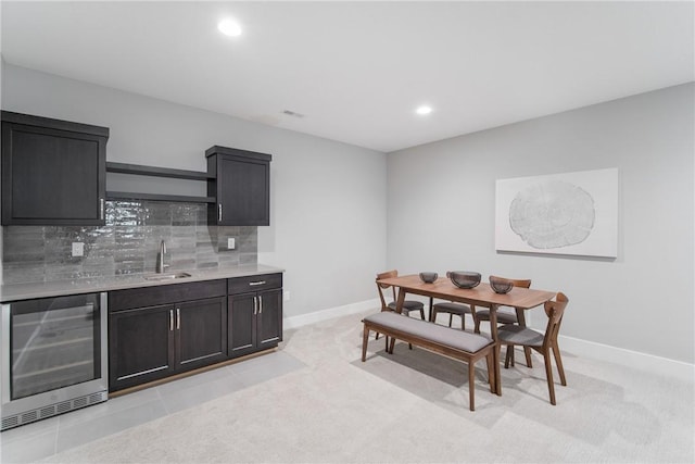 tiled dining area featuring sink and wine cooler