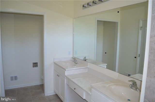 bathroom with tile patterned floors, vanity, and toilet