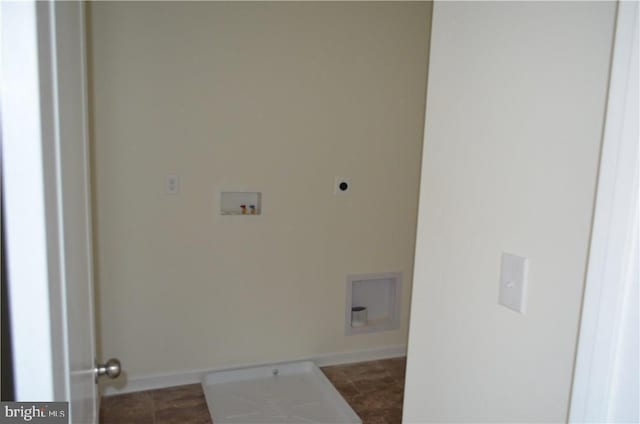 clothes washing area featuring electric dryer hookup, hookup for a washing machine, and tile patterned flooring