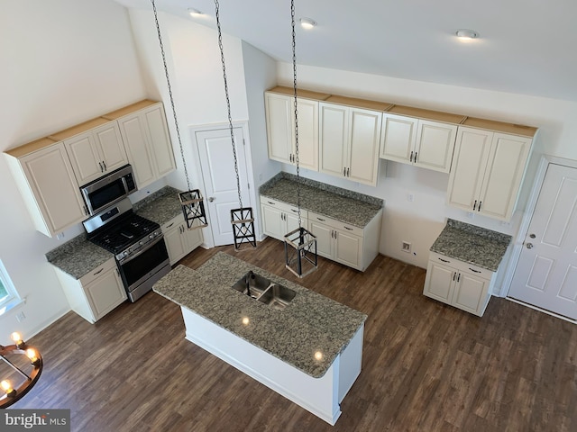 kitchen featuring white cabinetry, stainless steel appliances, and dark hardwood / wood-style floors