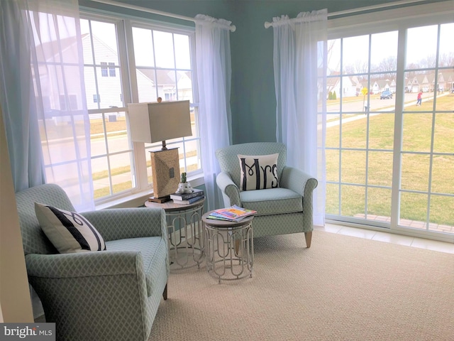 sitting room featuring tile patterned flooring