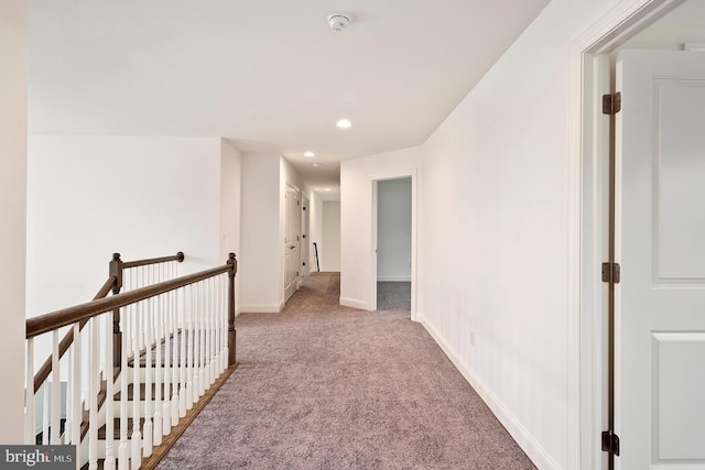 corridor with light colored carpet