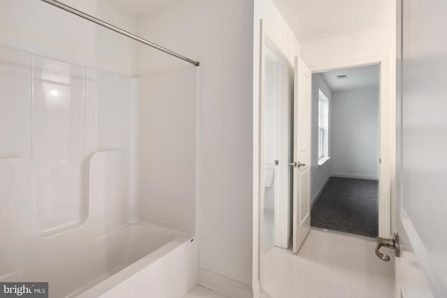 bathroom featuring bathtub / shower combination and tile patterned floors