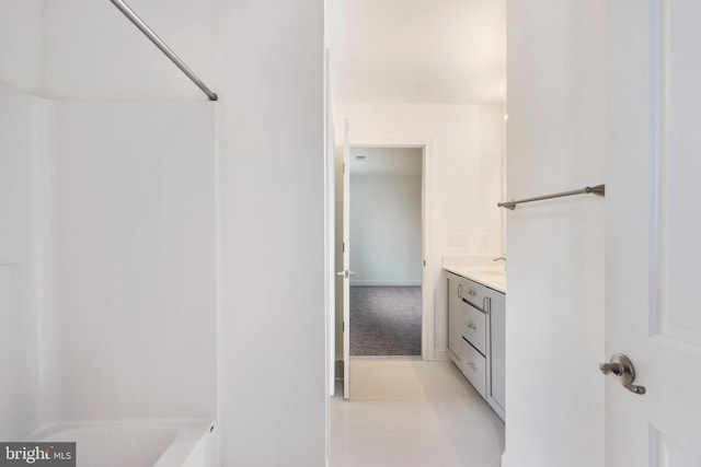 bathroom with tile patterned floors and vanity