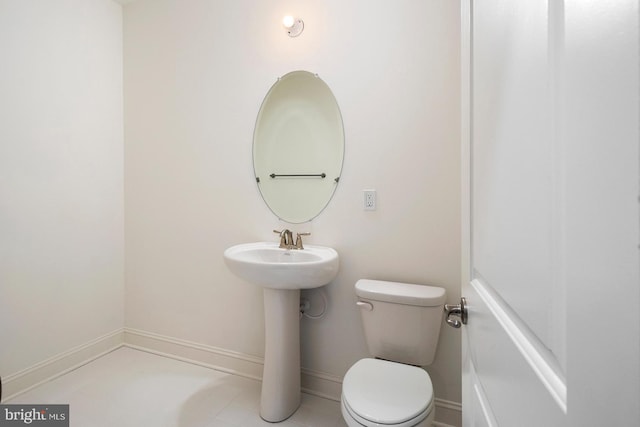 bathroom featuring tile patterned floors and toilet