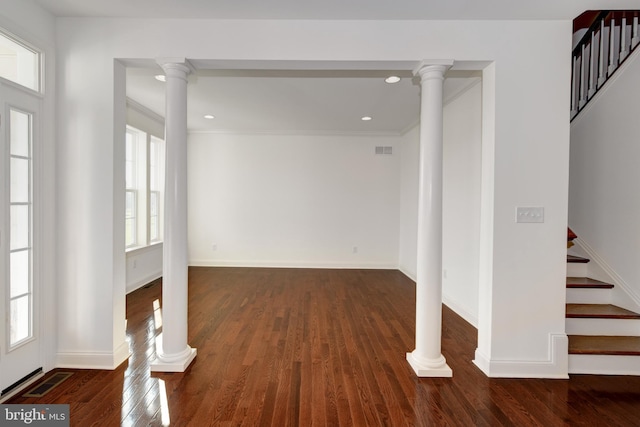 interior space featuring dark hardwood / wood-style flooring and ornamental molding