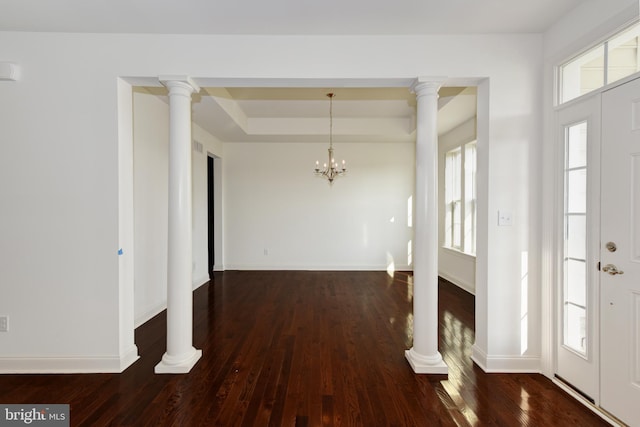 interior space featuring dark wood-type flooring and a notable chandelier