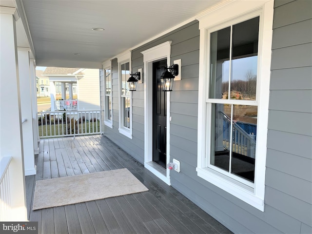 wooden terrace featuring a porch