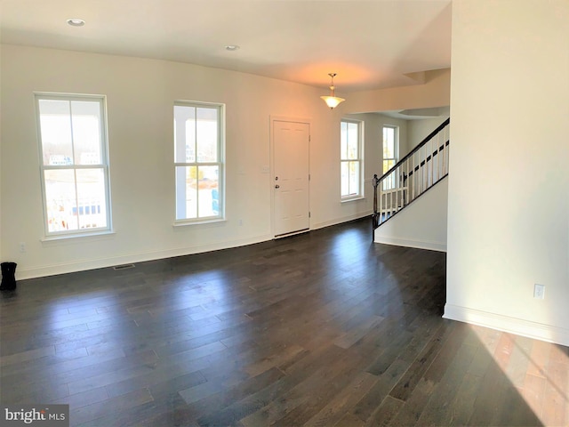 entrance foyer featuring dark wood-type flooring