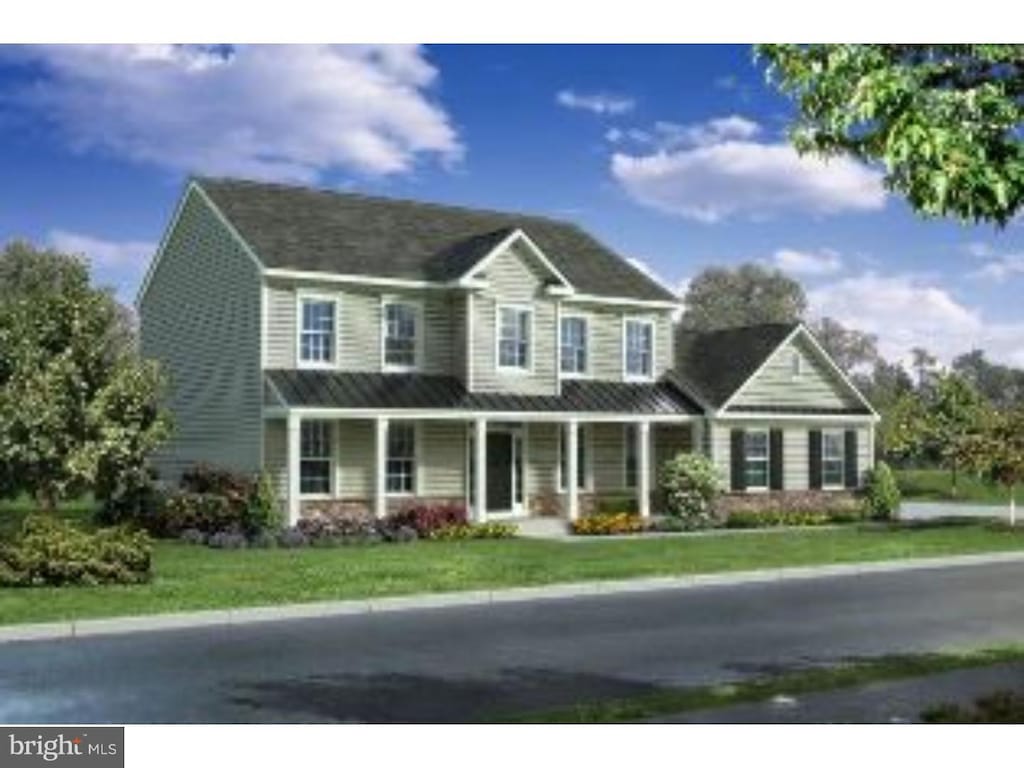 view of front facade featuring a front yard