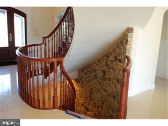 stairs featuring french doors