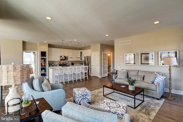 living room with dark hardwood / wood-style floors