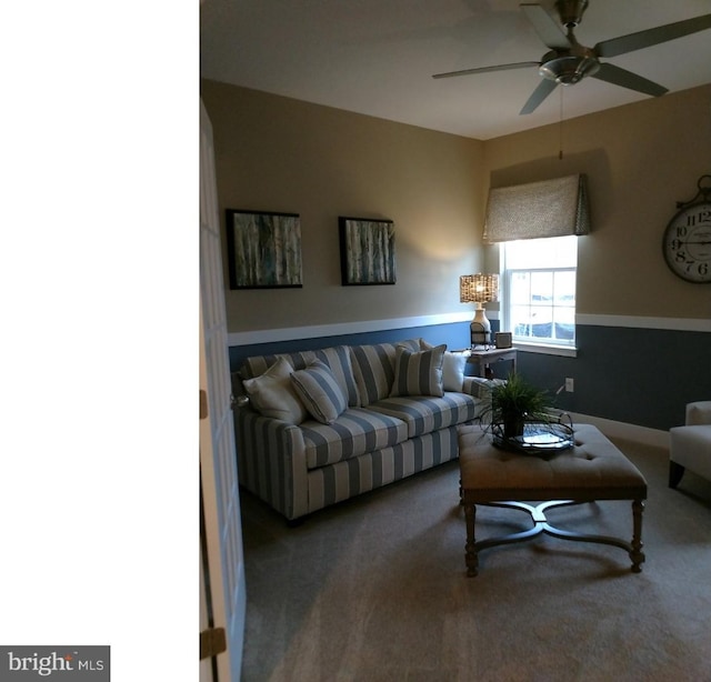 living room with ceiling fan and carpet floors