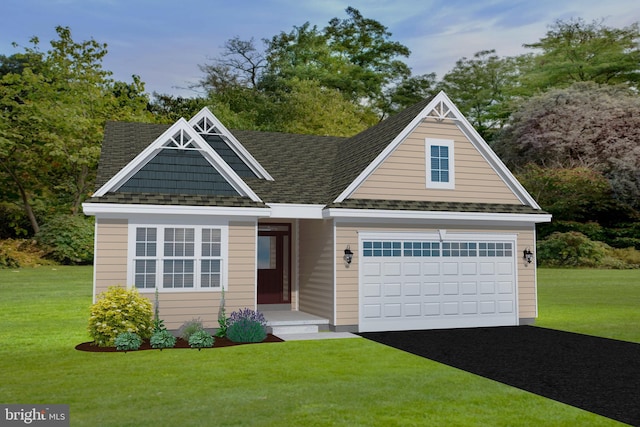 view of front of house featuring a front lawn and a garage