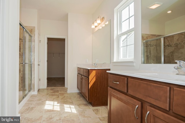 bathroom with a healthy amount of sunlight and an enclosed shower