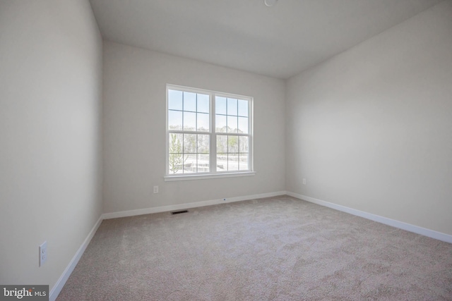 unfurnished room featuring carpet flooring