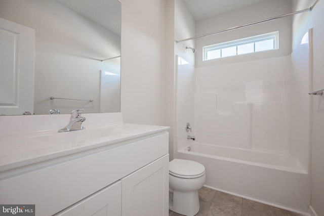 full bathroom with tile patterned floors, toilet, vanity, and tub / shower combination