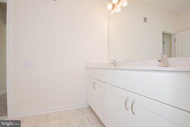 bathroom featuring tile patterned floors and vanity