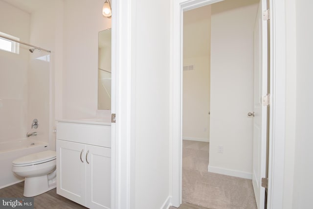 full bathroom featuring vanity, toilet, wood-type flooring, and bathtub / shower combination