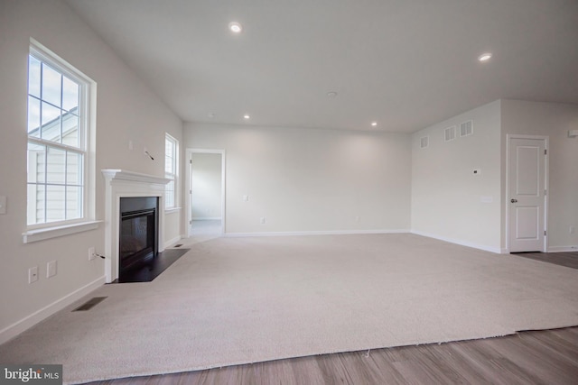 unfurnished living room featuring wood-type flooring