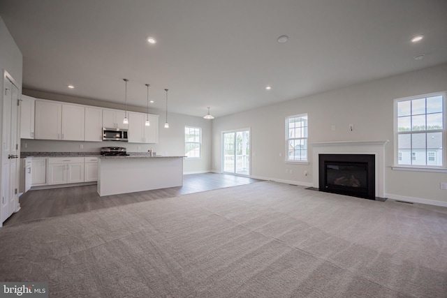 unfurnished living room with carpet flooring