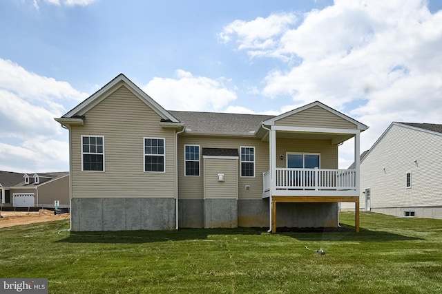 rear view of property with covered porch and a yard