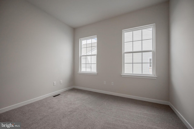 spare room with carpet flooring