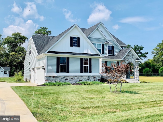 craftsman-style home with a garage and a front lawn