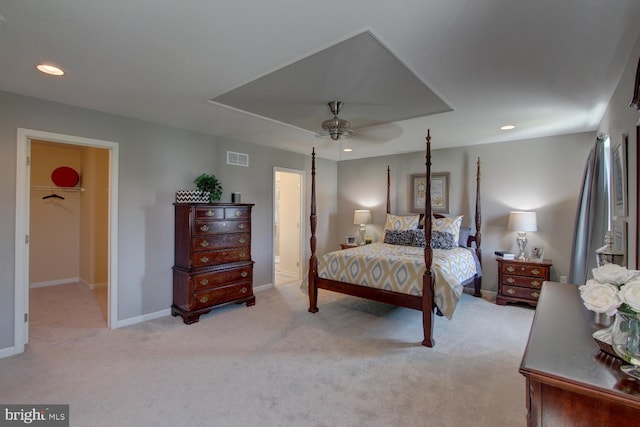 bedroom with ceiling fan and light carpet