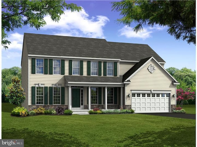 colonial inspired home with a front yard and a garage