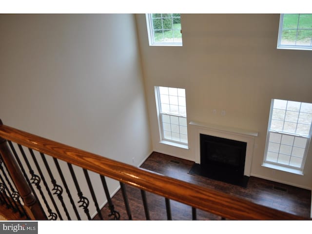 unfurnished living room featuring dark hardwood / wood-style floors