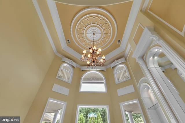 room details featuring a notable chandelier and ornamental molding