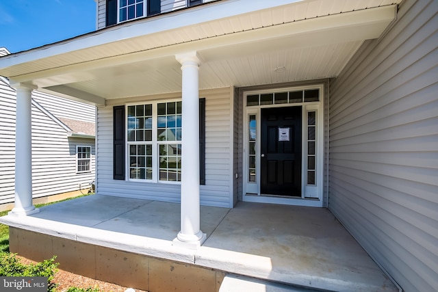 property entrance with covered porch