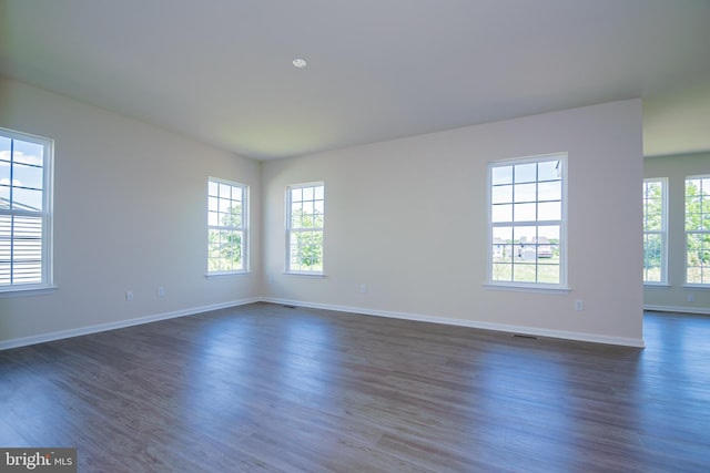 unfurnished room featuring dark hardwood / wood-style floors