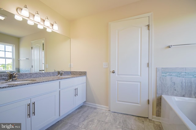 bathroom featuring double sink vanity, tile flooring, and a tub