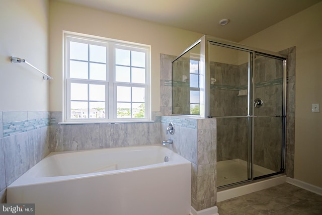 bathroom with plus walk in shower and tile floors