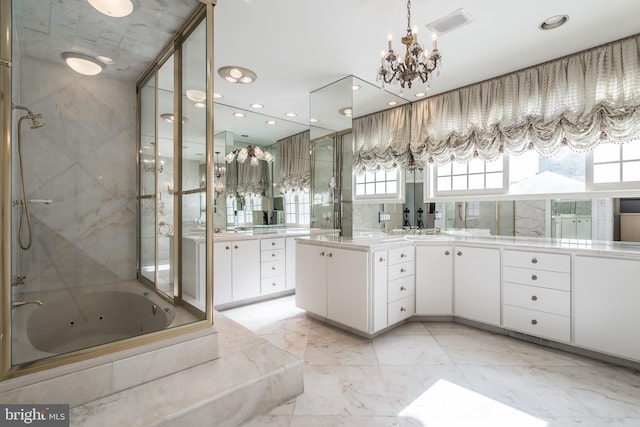 bathroom featuring vanity and shower with separate bathtub