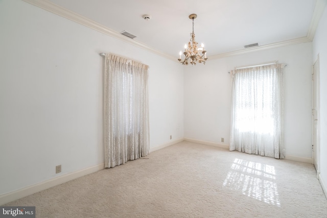 empty room featuring a chandelier, crown molding, and light colored carpet