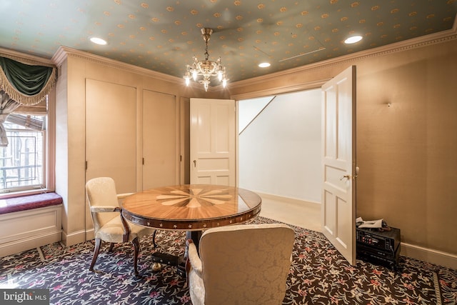 dining room with carpet flooring, ornamental molding, and a chandelier