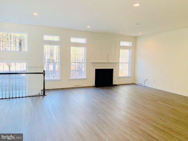 unfurnished living room with light hardwood / wood-style floors