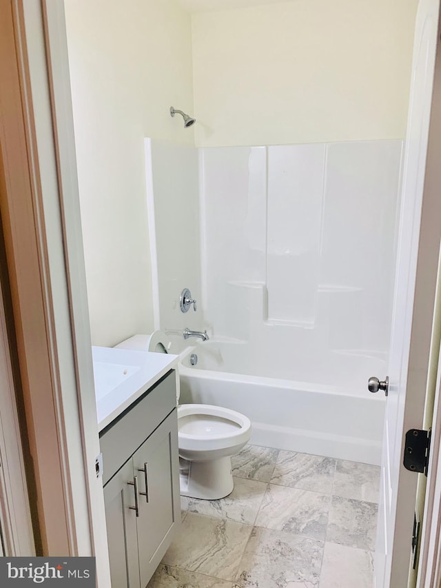 full bathroom with vanity, shower / bathtub combination, and toilet