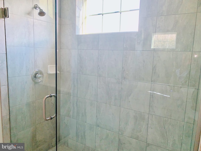 bathroom featuring an enclosed shower