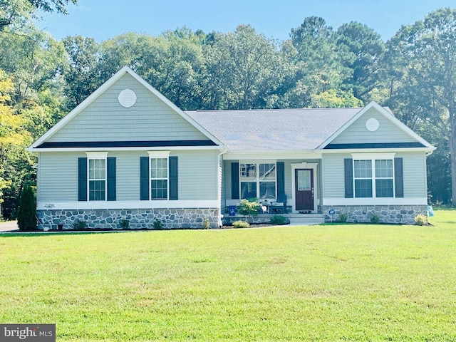 view of front of house with covered porch and a front yard