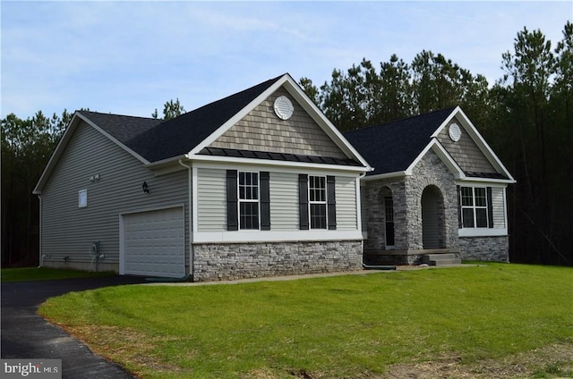 craftsman inspired home with a garage and a front lawn