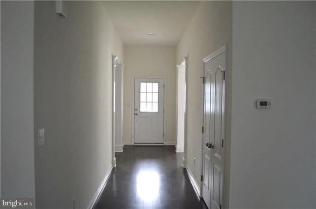 corridor featuring dark hardwood / wood-style floors