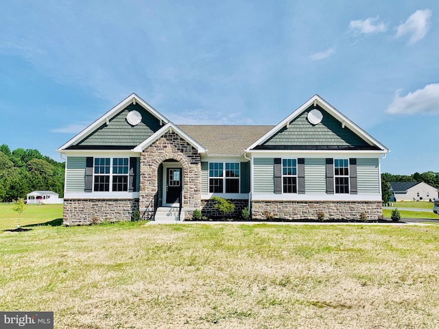 craftsman-style home with a front yard